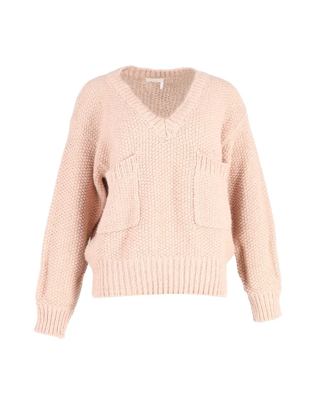 Create a timeless wardrobe with fashionable pieces   Chloé Oversized Chunky V-Neck Sweater in Peach Wool